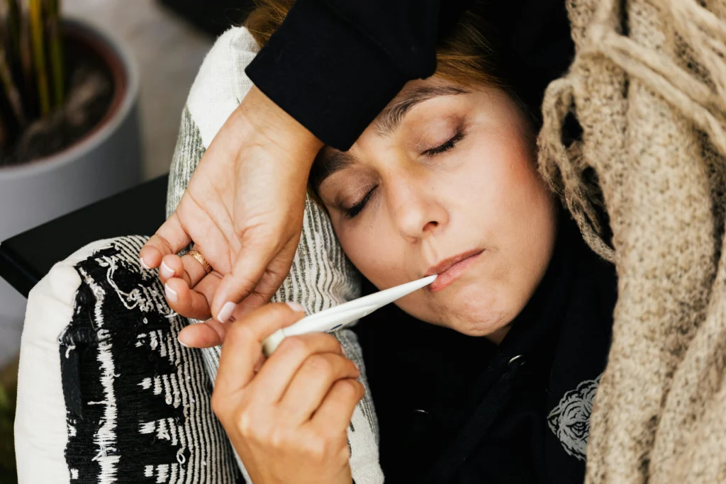 Woman with fever and fatigue after vaccination showing mild pneumonia vaccine side effects