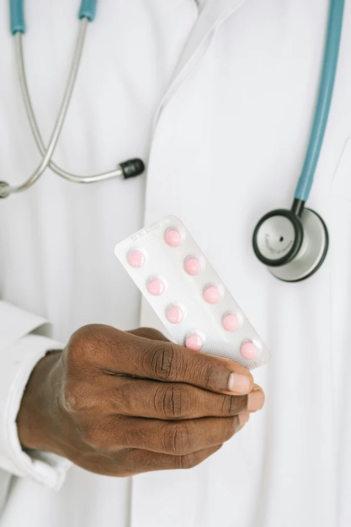 Does amoxicillin treat UTI - doctor holding antibiotic pills for urinary tract infection treatment