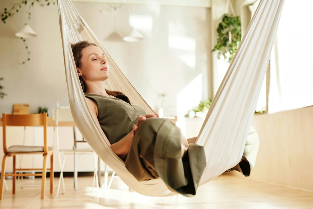 Woman relaxing in hammock for stress relief and better heart wellness while using Atorvastatin 40mg for cholesterol management