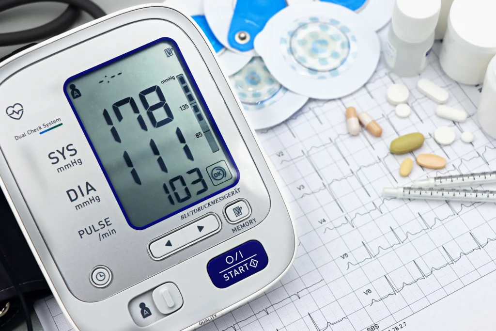 High blood pressure exercise guide showing a digital blood pressure monitor with an elevated blood pressure reading